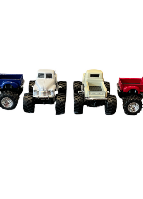 Four Chevy pickup monster truck toys in the colors blue, white, beige and red. The blue, beige and red trucks are positioned to show the truck bed. 