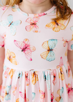 Model Wearing Mila & Rose Butterfly Kisses S/S Pocket Twirl Dress details