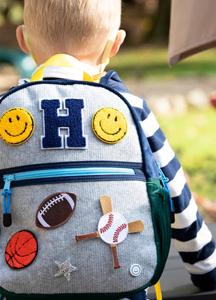 Model Using Becco Bags Small Becco Backpack - Kids Lux Navy/Hunter