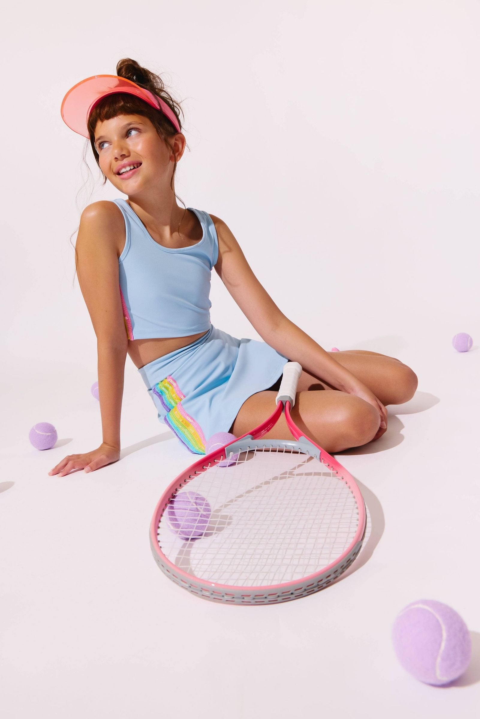 Model Wearing Lola And The Boys Blue Rainbow Sherbet Sequin Tennis Set