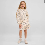 Model Wearing Miles The Label Bow Locket Sweatshirt & Skirt Set