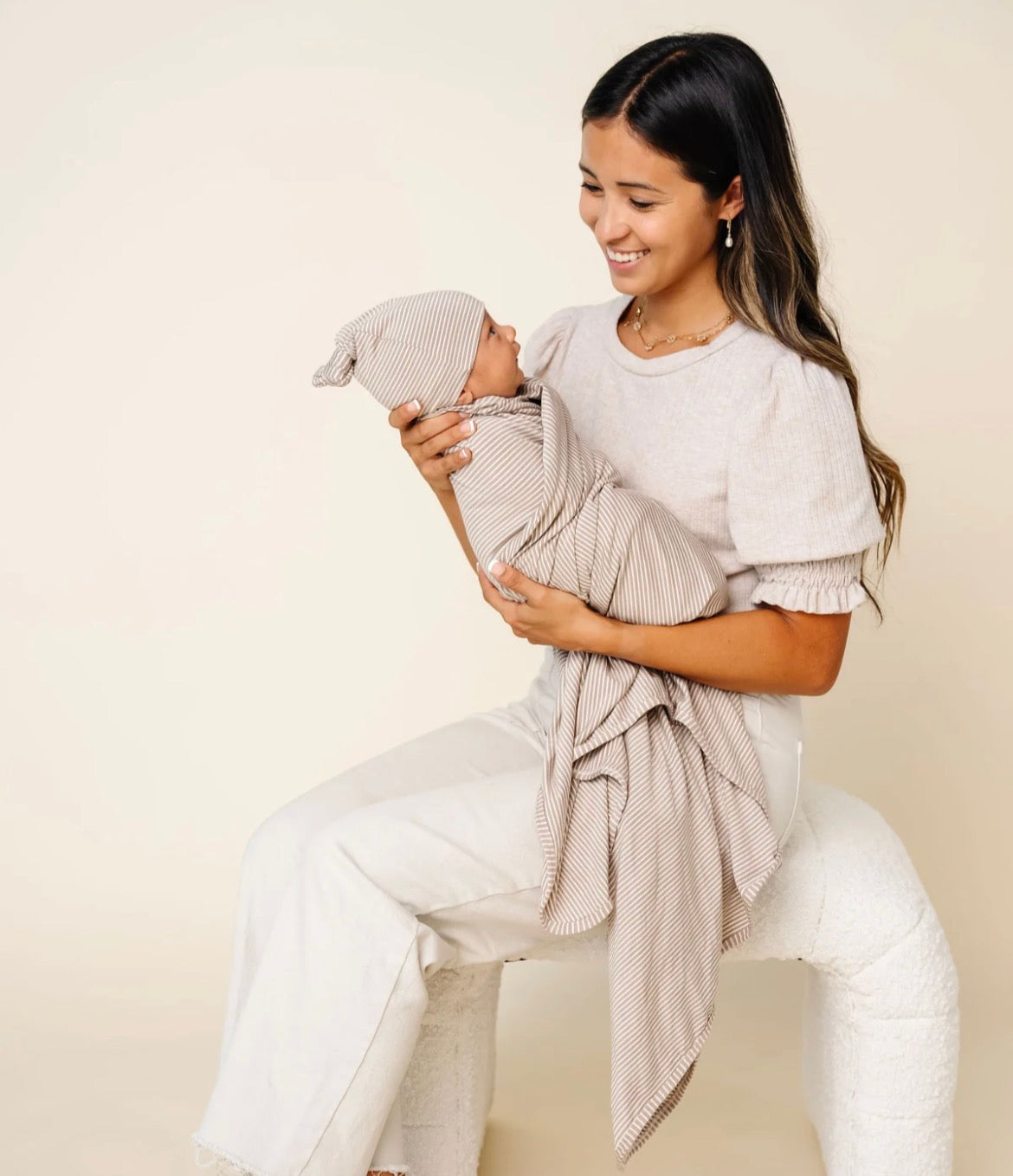 Model Wearing Lou Lou & Company Banks Swaddle Blanket