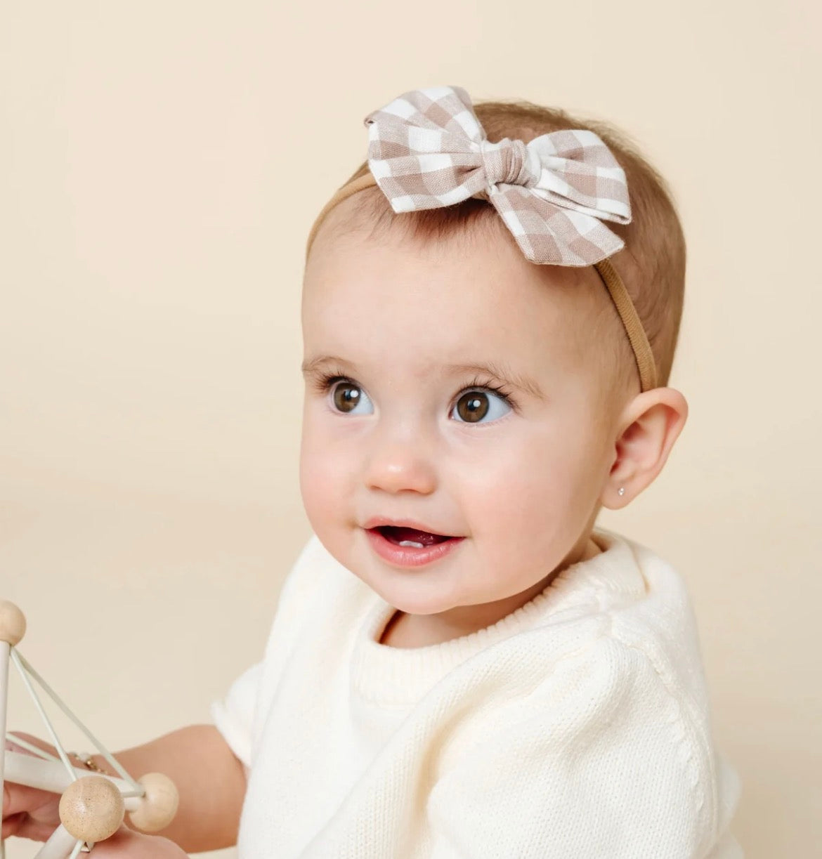 Model Wearing Lou Lou & Company Adventure Bow - Taupe Gingham Headband