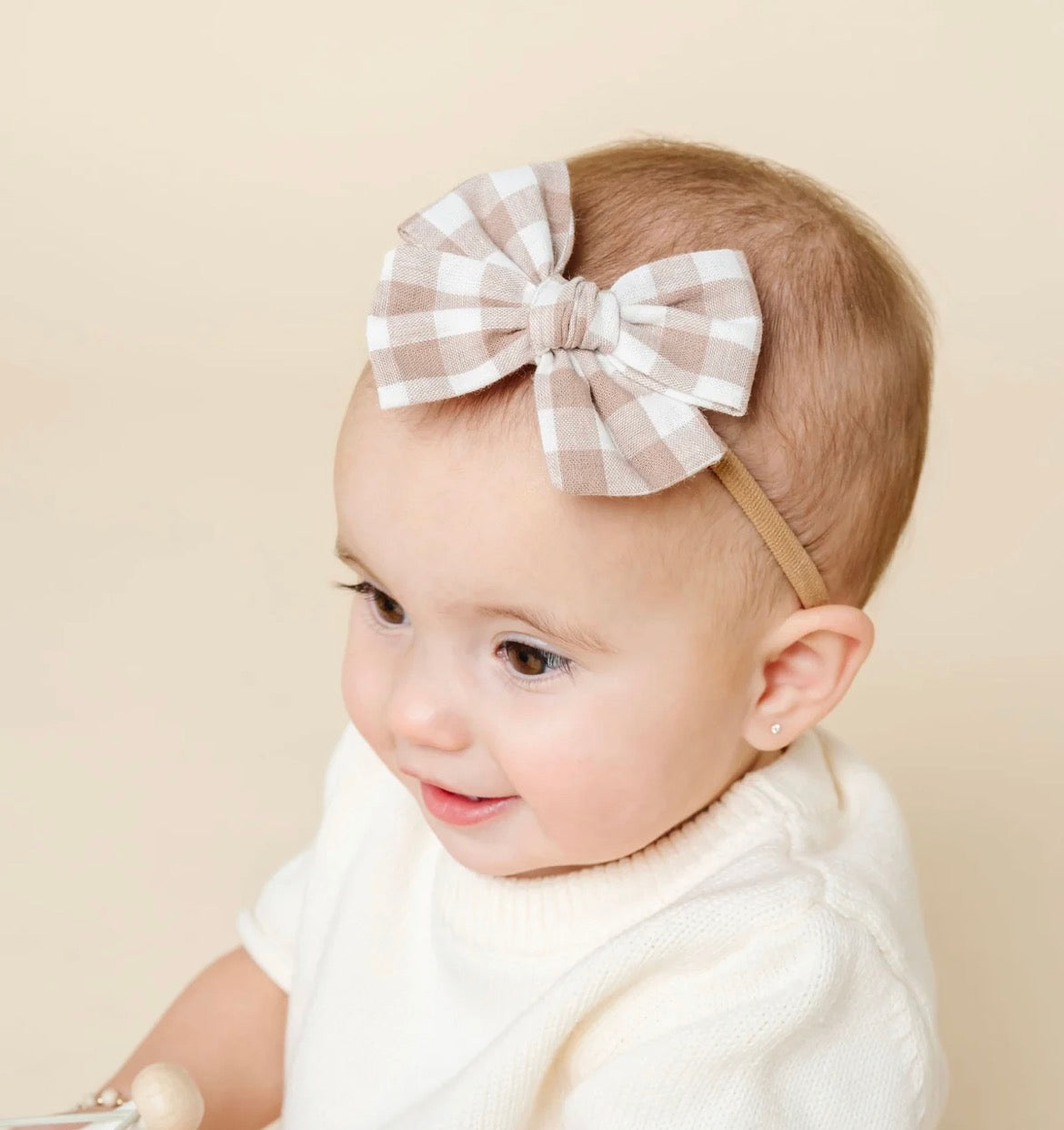 Model Wearing Lou Lou & Company Adventure Bow - Taupe Gingham Headband