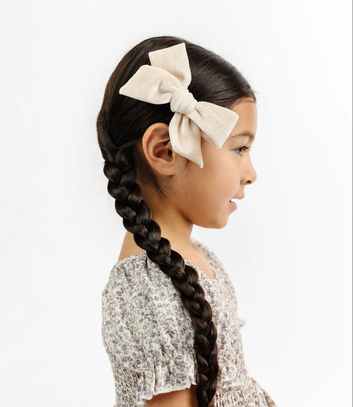 Model Wearing Lou Lou & Company Bow 3 Pack: Ivory Clips