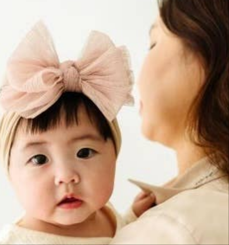 Model Wearing Baby Bling Bows Baby Bling® Tulle Fab® Soft Nylon Headband with Tulle Bow