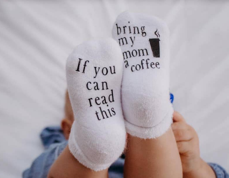 Model Wearing Dorothy's Reason If You Can Read This Bring My Mom A Coffee® Baby Socks Gifts