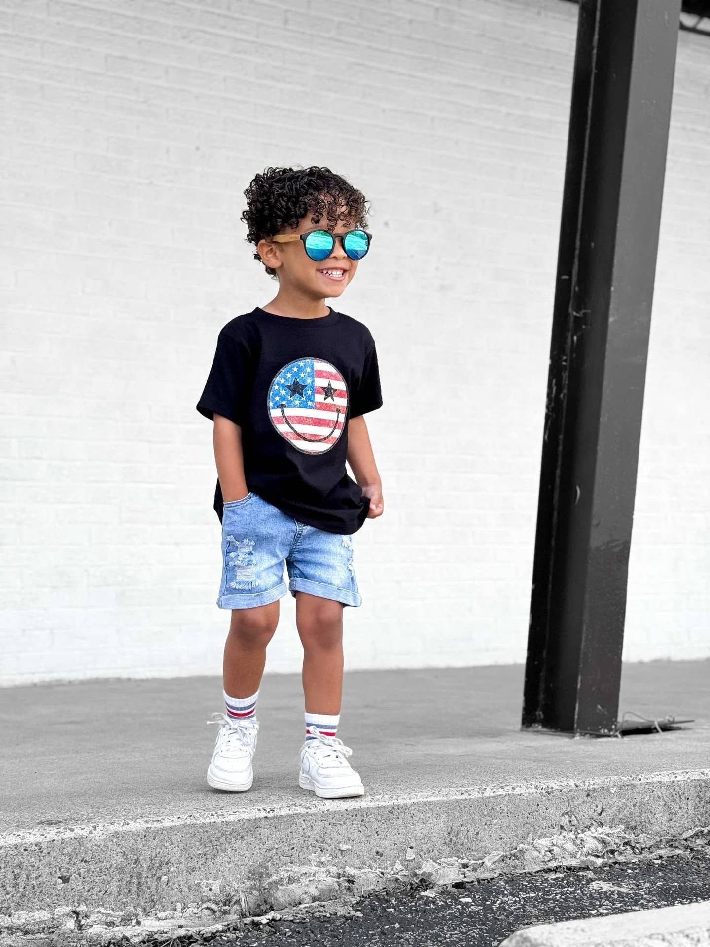 Model Wearing Holland Ave Kids Patriotic Fourth of July Smiley Graphic Tee