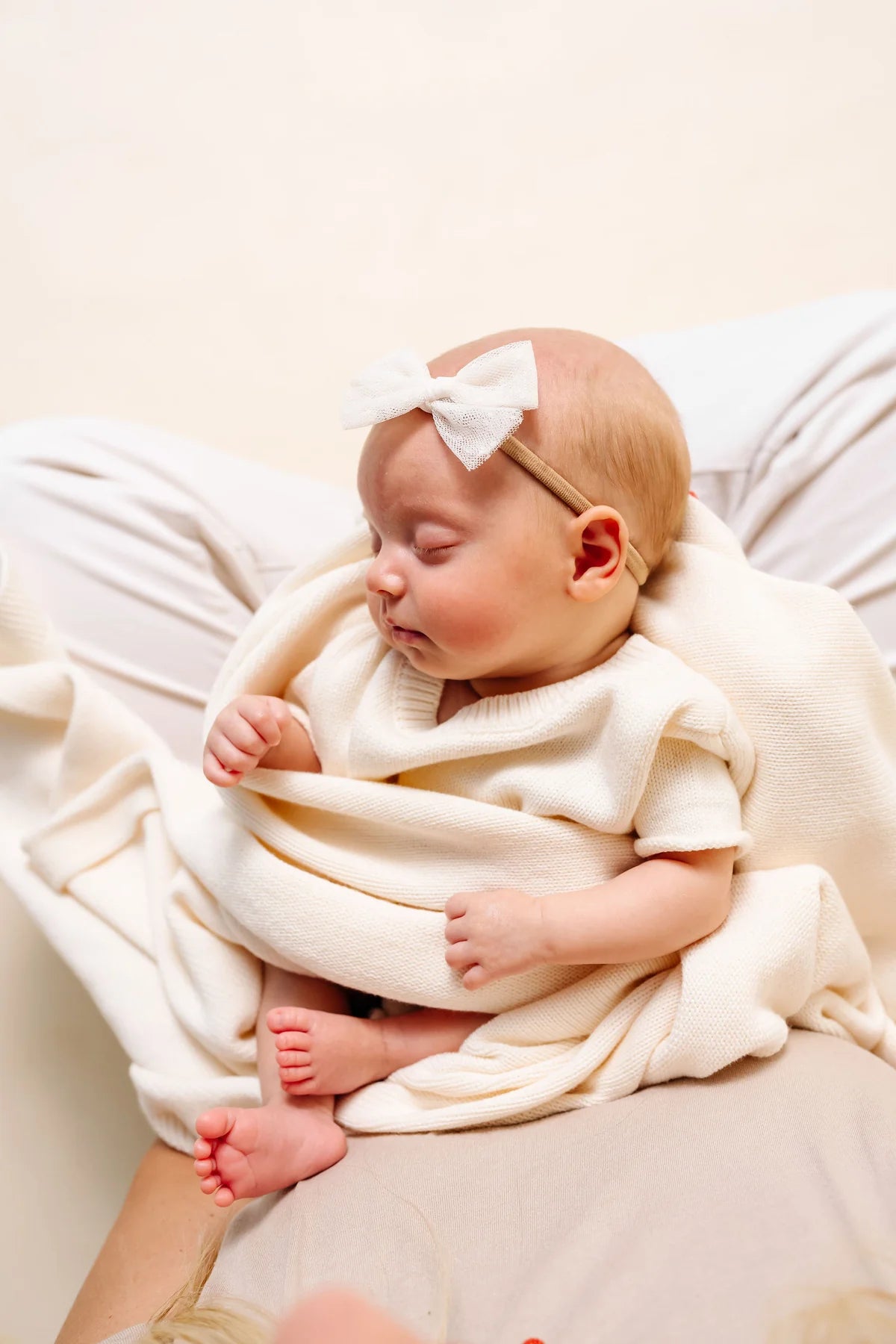 Model Using Lou Lou & Company Knit Blanket - Ivory 