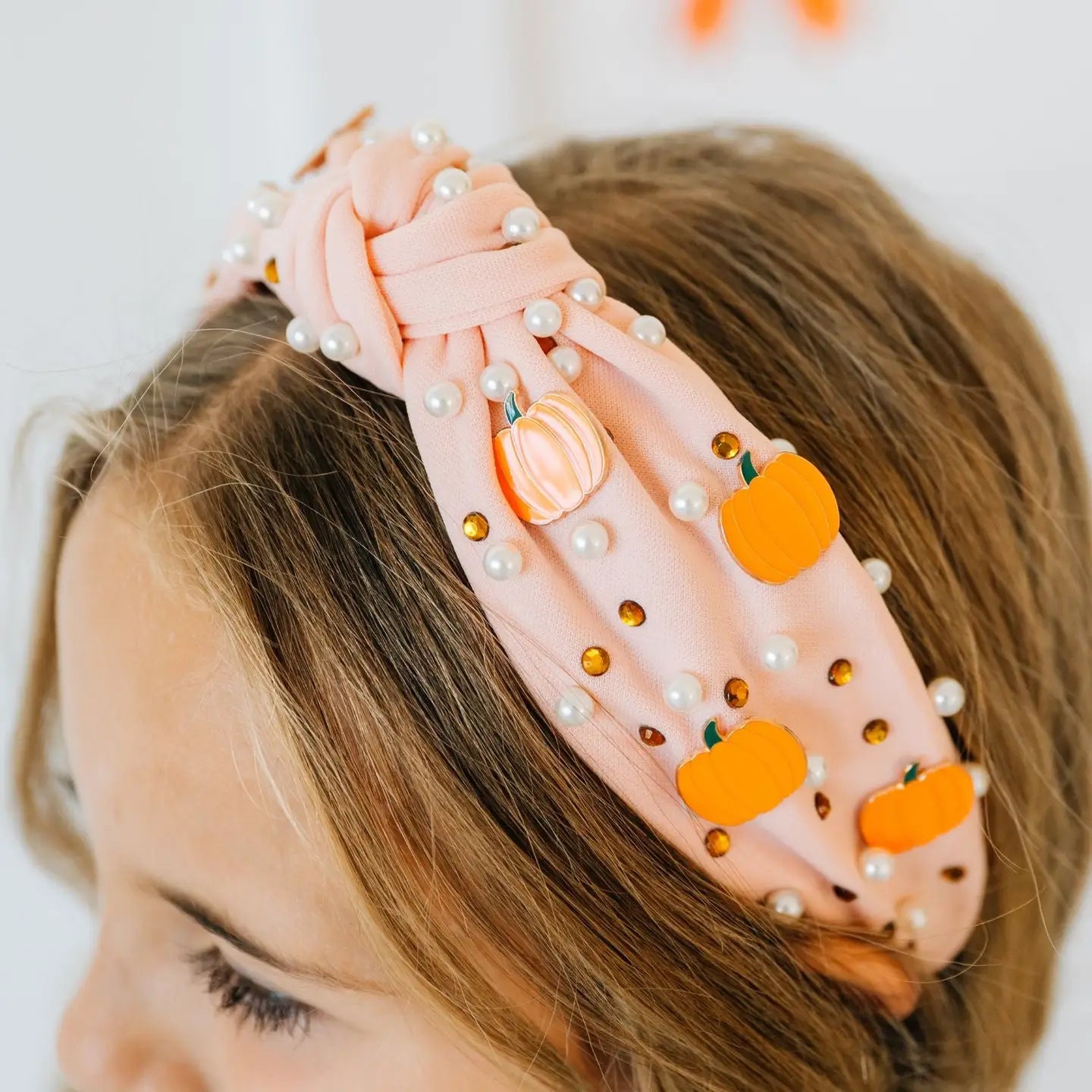 Model Wearing Sweet Wink Pumpkin Pearl Gemstone Headband - Kids Hair Accessories