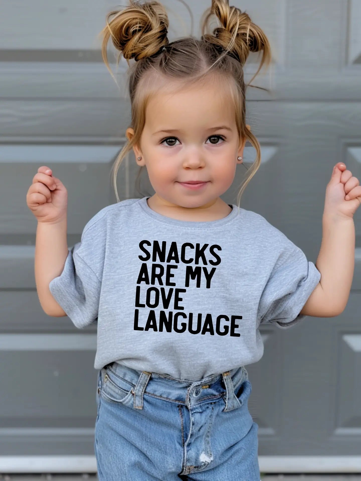 Model Wearing Little Threads Co. Snacks Are My Love Language Toddler T-Shirt