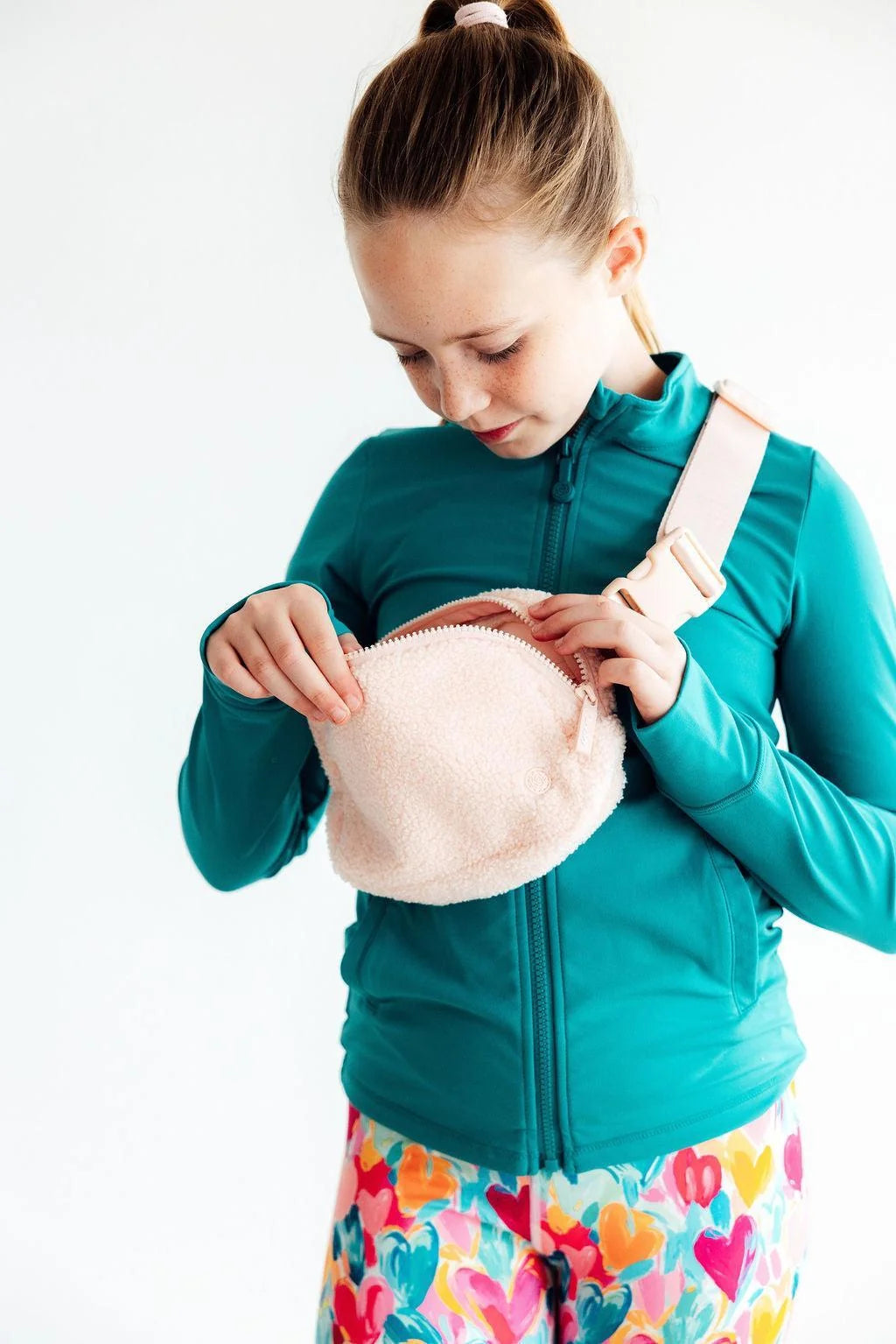 Model Wearing Mila & Rose Light Pink Fleece Belt Bag
