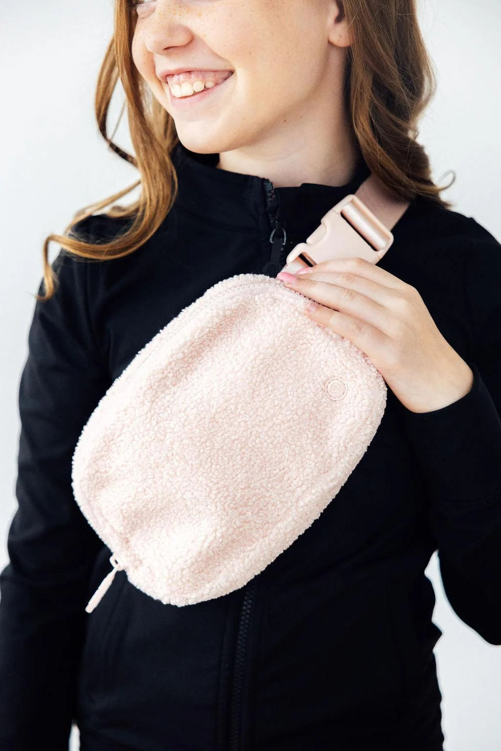 Model Wearing Mila & Rose Light Pink Fleece Belt Bag