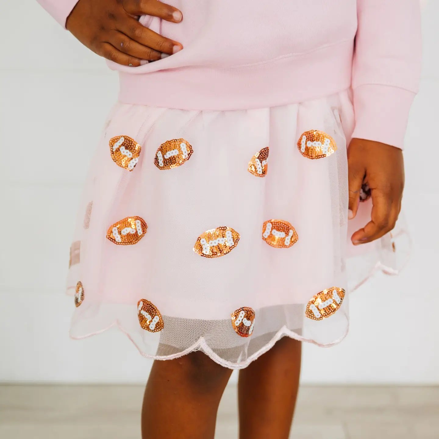 Model Wearing Sweet Wink Mini Sequin Footballs Tutu Skirt - Game Day - Kids Clothing