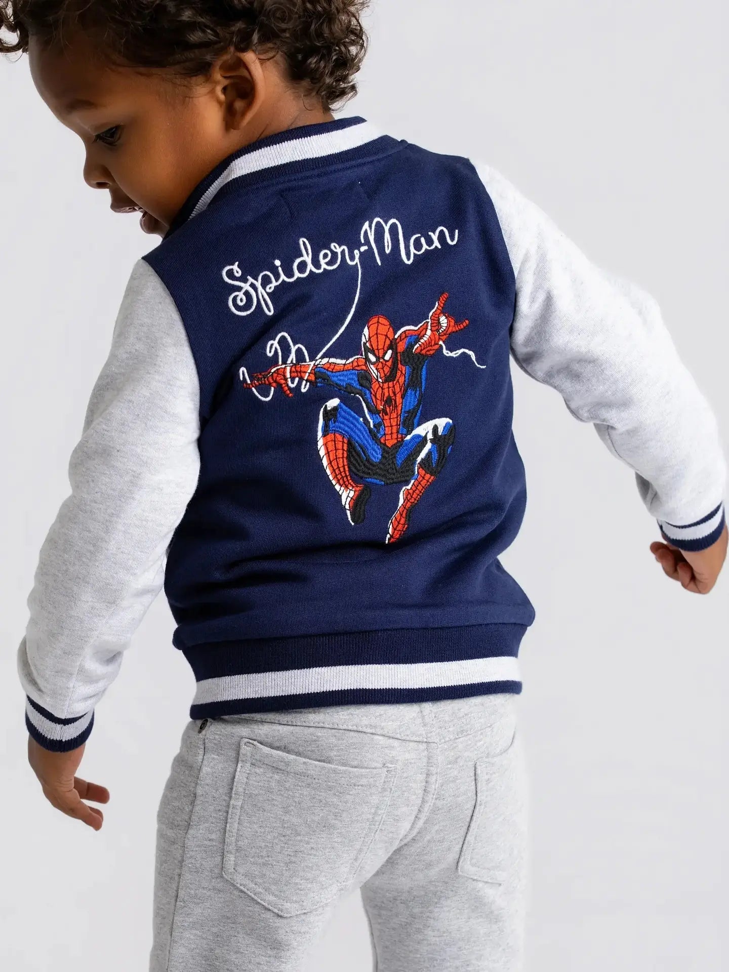 Model Wearing Monica + Andy Zip Bomber Jacket_marvel Spider-Man On Blue