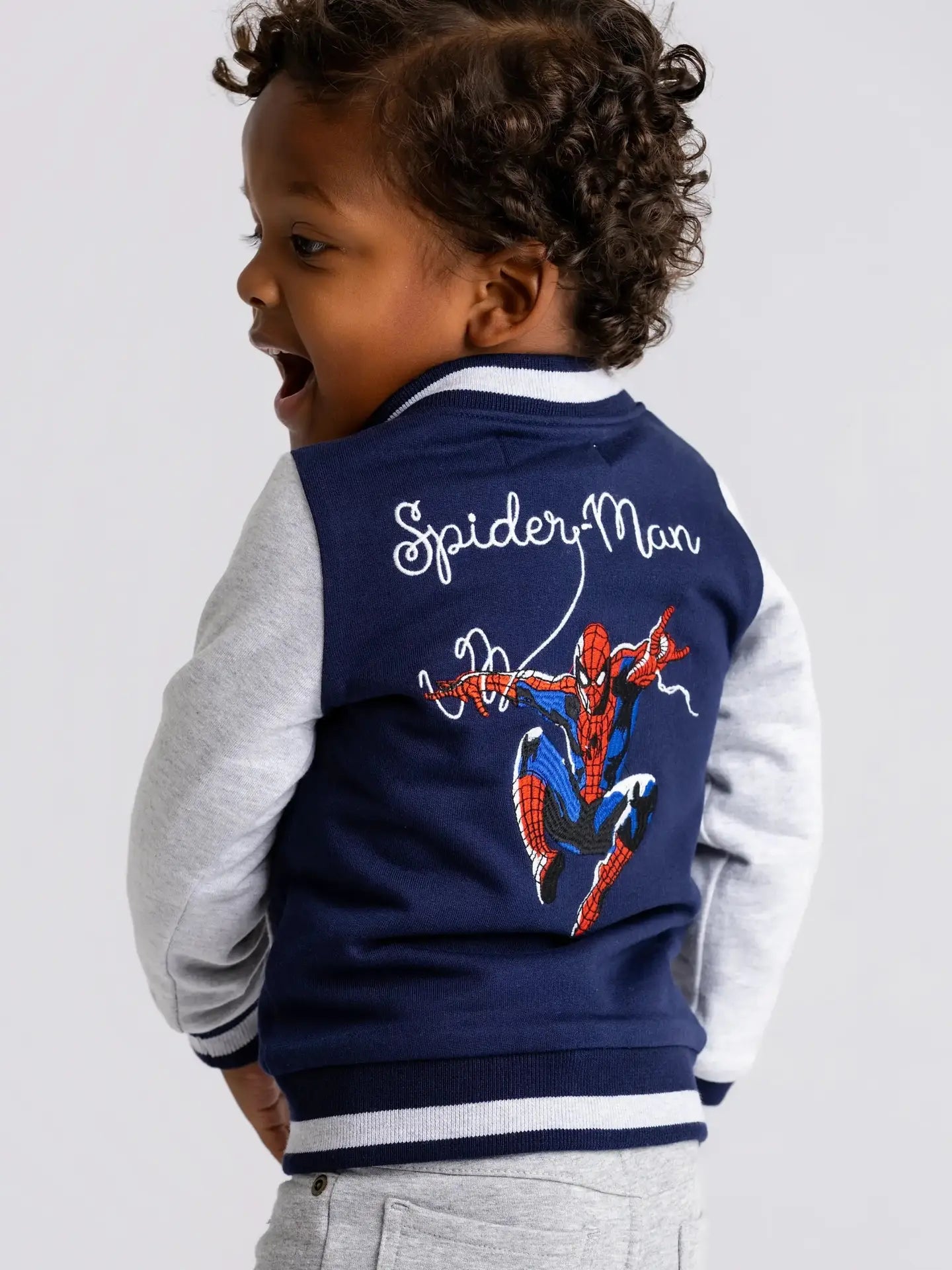 Model Wearing Monica + Andy Zip Bomber Jacket_marvel Spider-Man On Blue