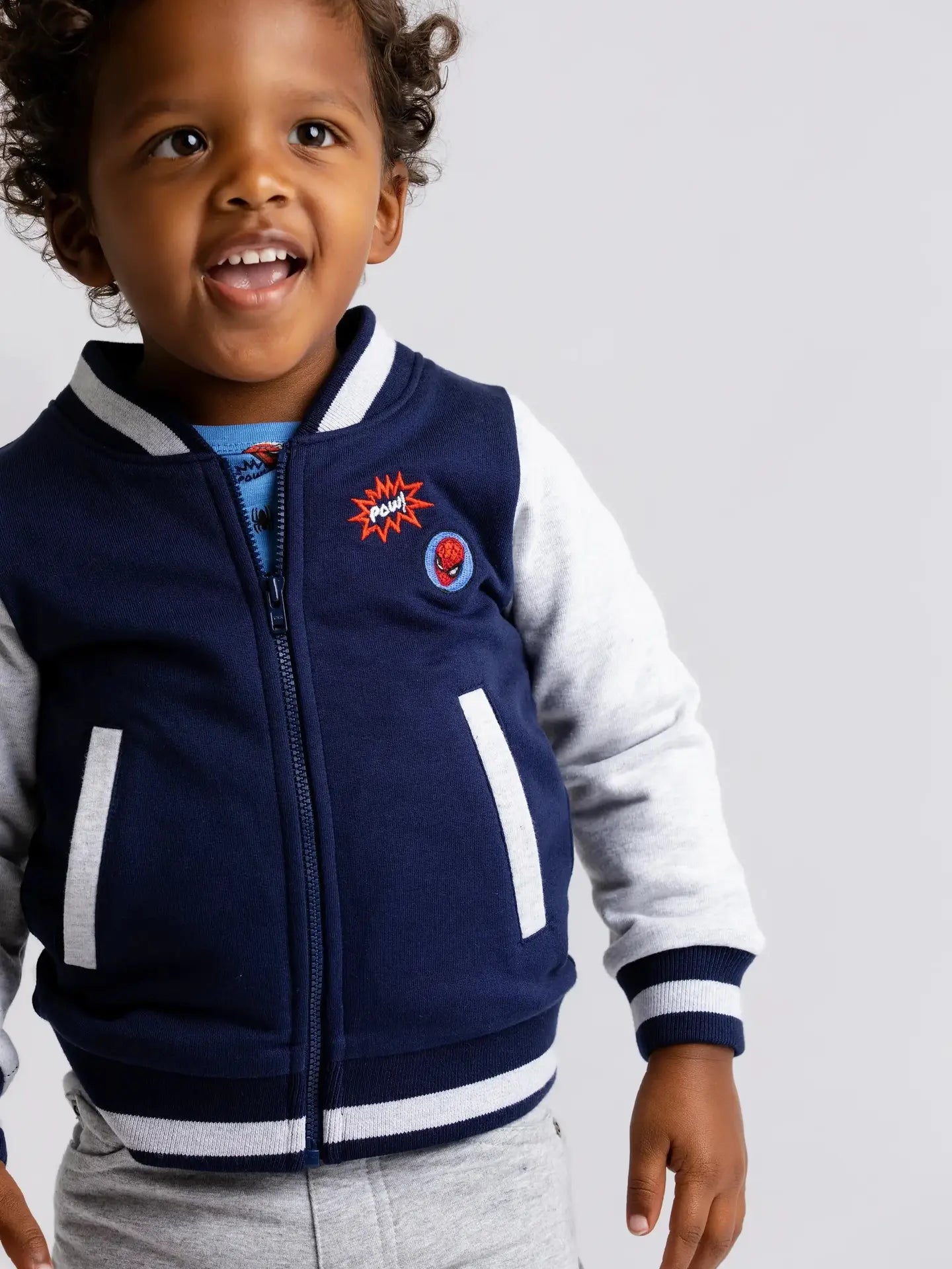 Model Wearing Monica + Andy Zip Bomber Jacket_marvel Spider-Man On Blue