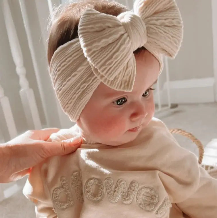 Model Wearing Luna + Luca Stretch Bow Headband - Cream