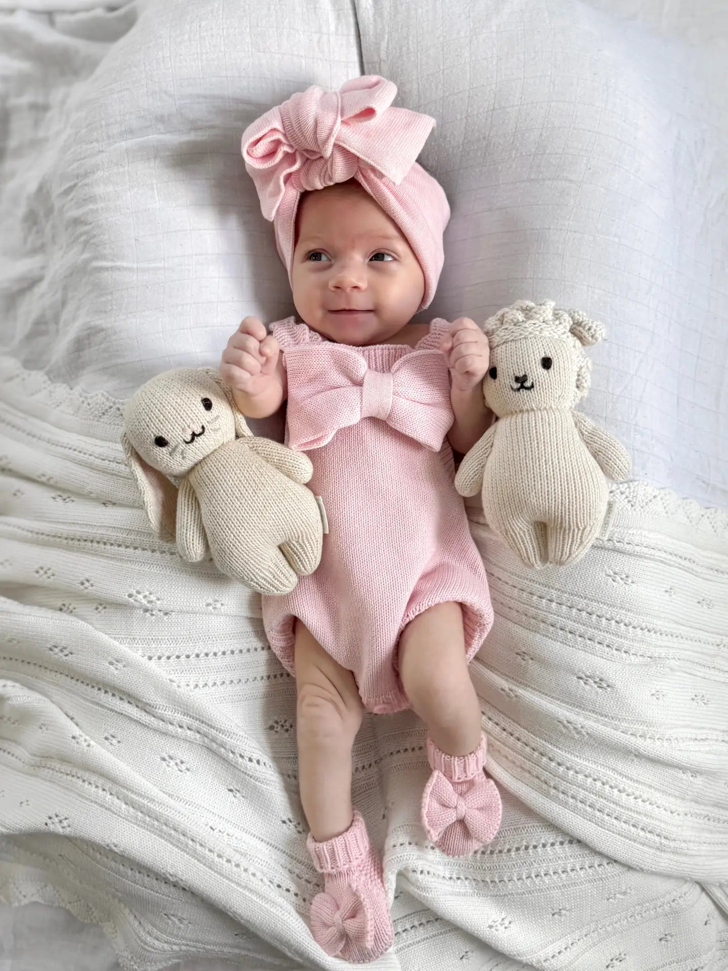 Model Wearing Luna + Luca Oversized Bow Romper - Powder Pink