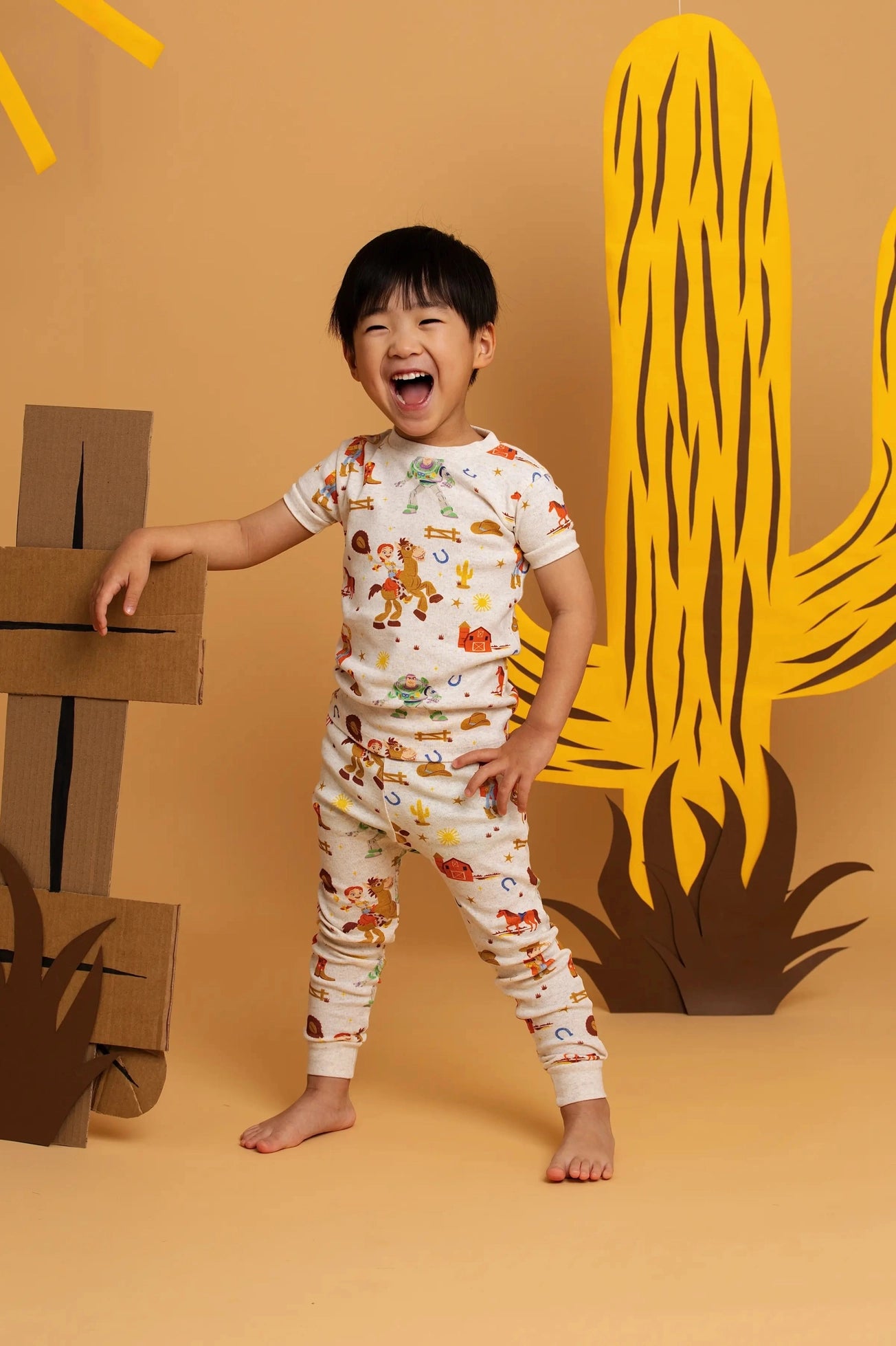 Model Wearing Monica + Andy Short Sleeve Two-Piece Pajama Set_toy Story Western Friends