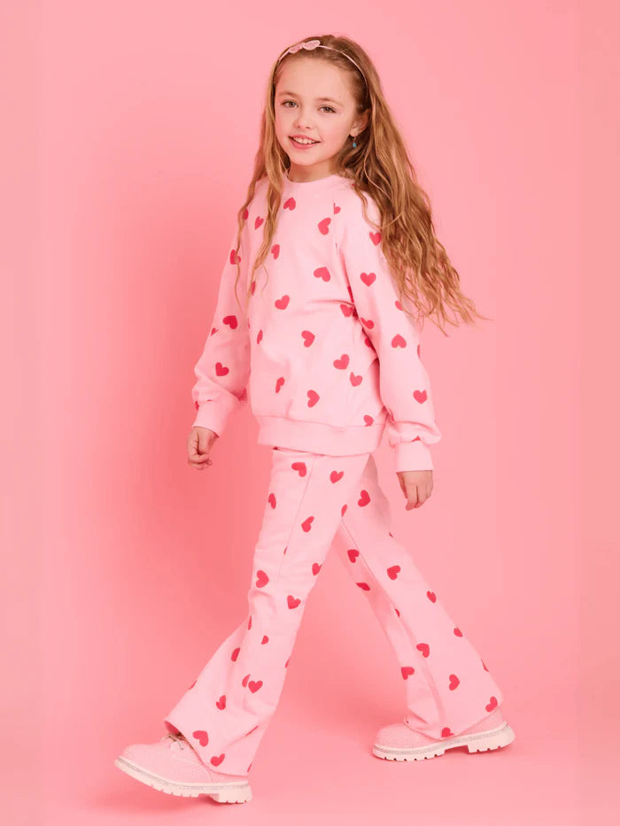 Model Wearing Lola And The Boys Pink Sparkle Sweetheart Lounge Set