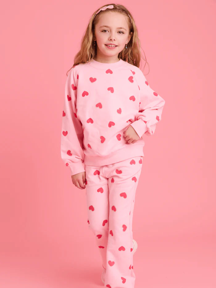 Model Wearing Lola And The Boys Pink Sparkle Sweetheart Lounge Set