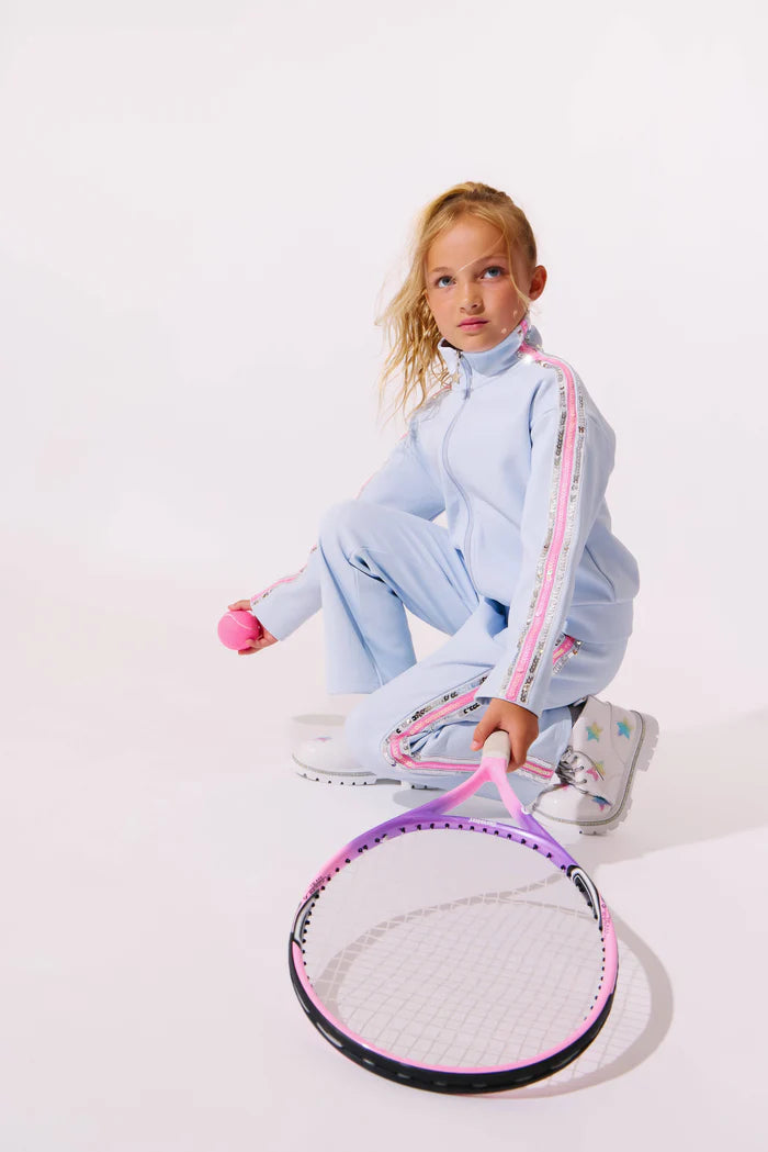 Model Wearing Lola And The Boys Rainbow Stripe Soft Scuba Tracksuit