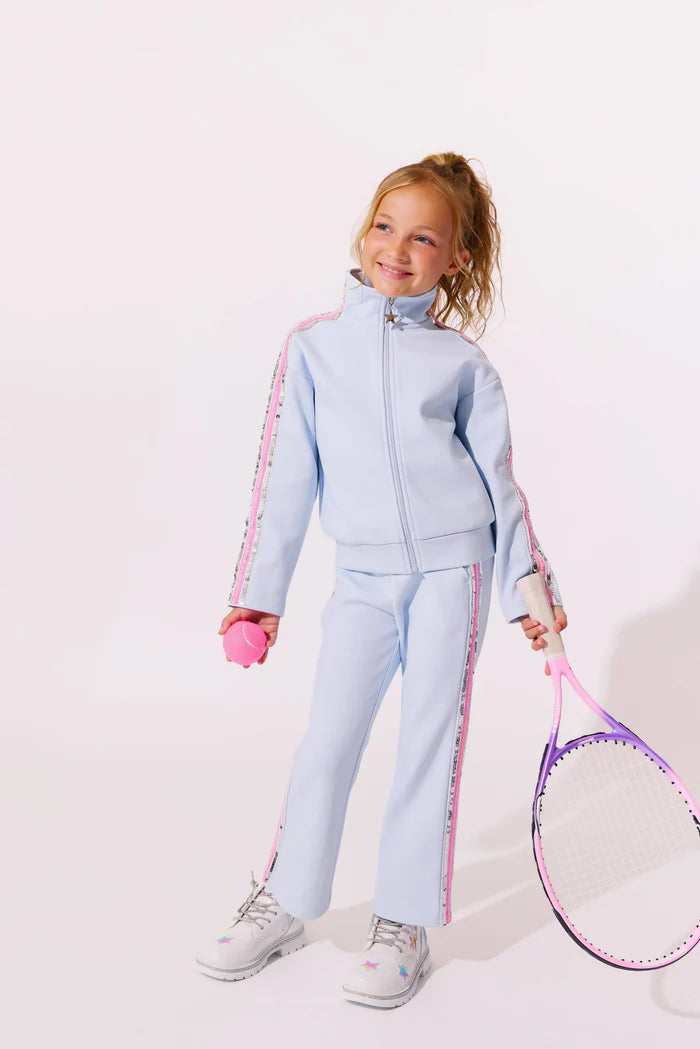 Model Wearing Lola And The Boys Rainbow Stripe Soft Scuba Tracksuit