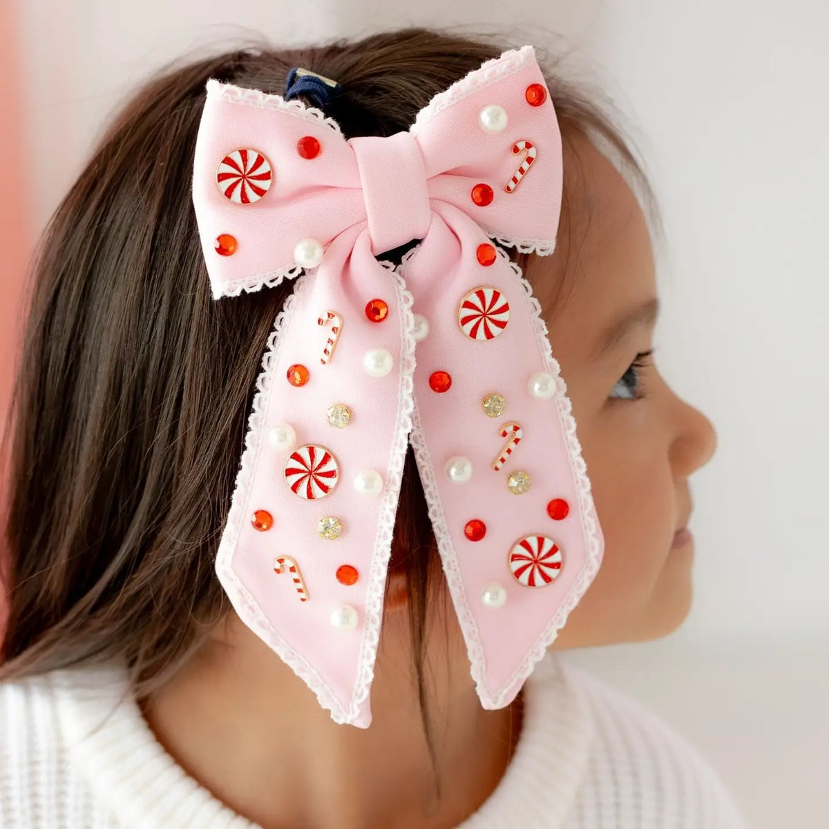 Model Wearing Sweet Wink Candy Cane Christmas Gemstone Bow Clip - Kids Hair Accessory