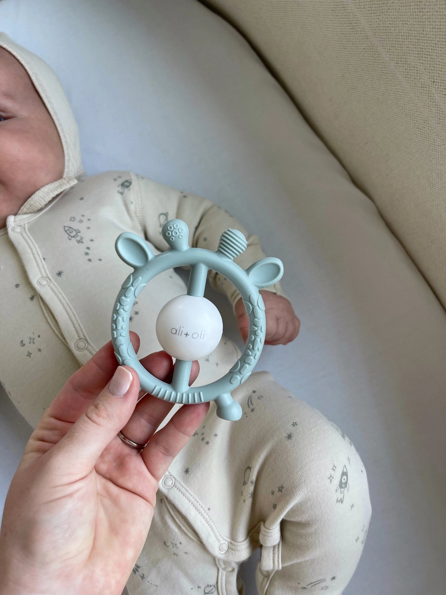 Model Using Ali + Oli Giraffe Teether & Rattle Food-Grade Silicone Toy (Mist)