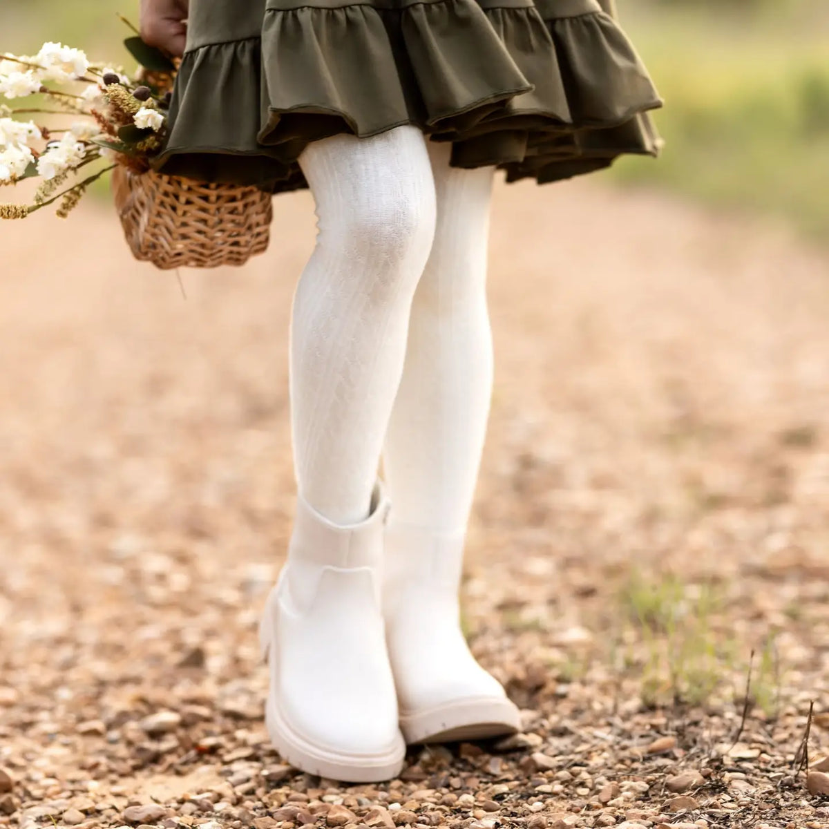 Model Wearing Little Stocking Co. Ivory Cable Knit Tights