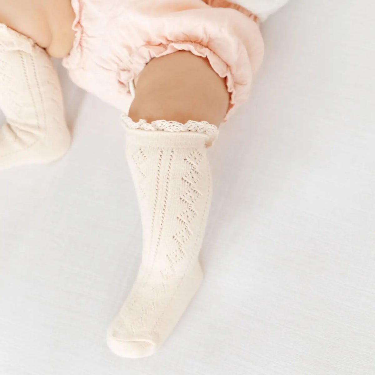 Model Wearing Little Stocking Co. Vanilla Fancy Lace Top Knee High Socks
