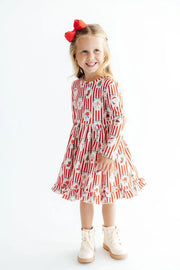 Model Wearing Mila & Rose Santa’s Sweet Schoppe Ruffle Hem Twirl Dress