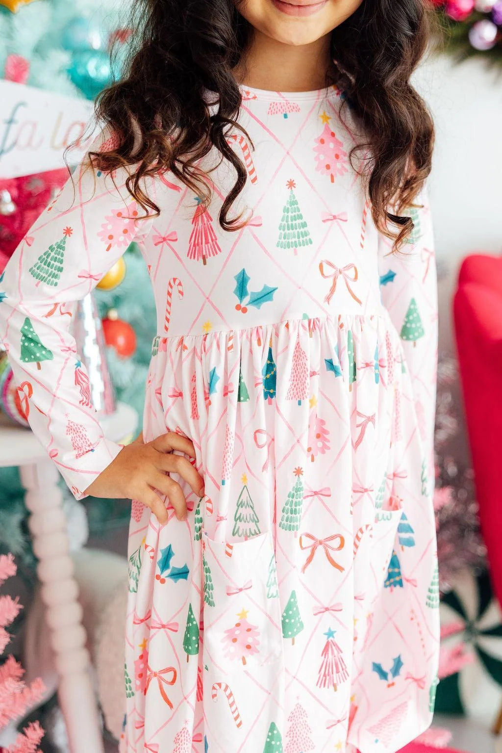 Model Wearing Mila & Rose Very Merry Long Sleeve Pocket Twirl Dress