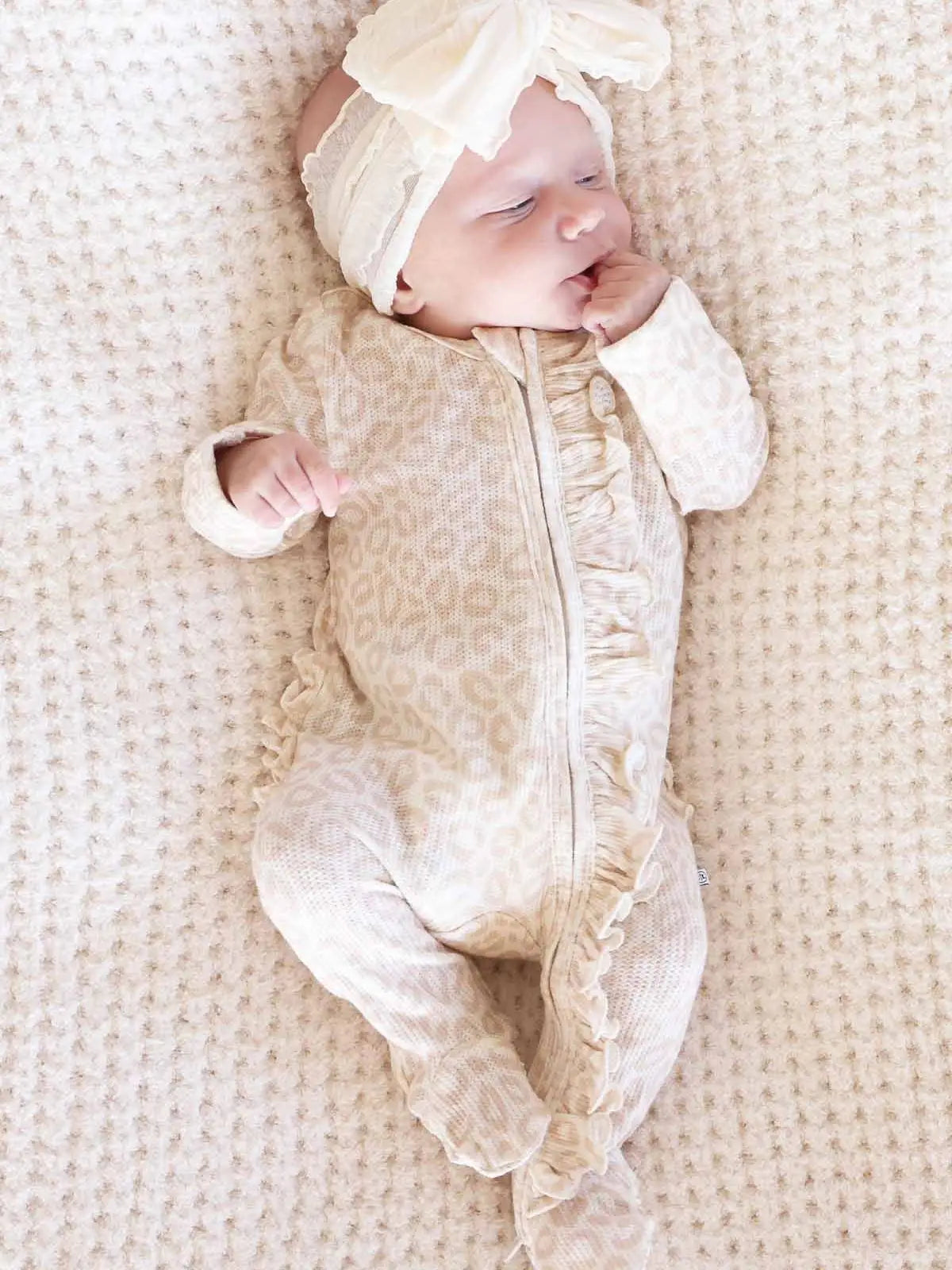 Model Wearing Caden Lane Bamboo Waffle Ruffle Zipper Footie | Lovely Leopard