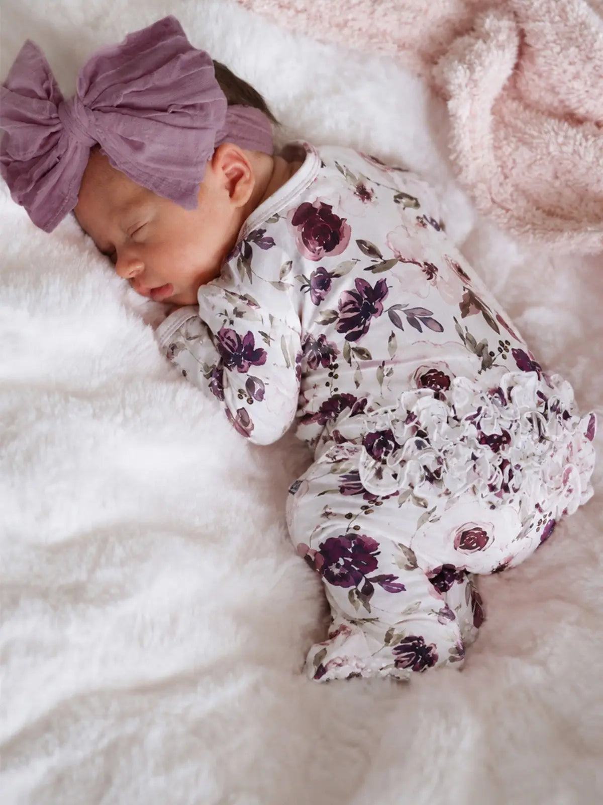 Model Wearing Caden Lane Demi's Dusty Purple Floral Ruffle Zipper Footie