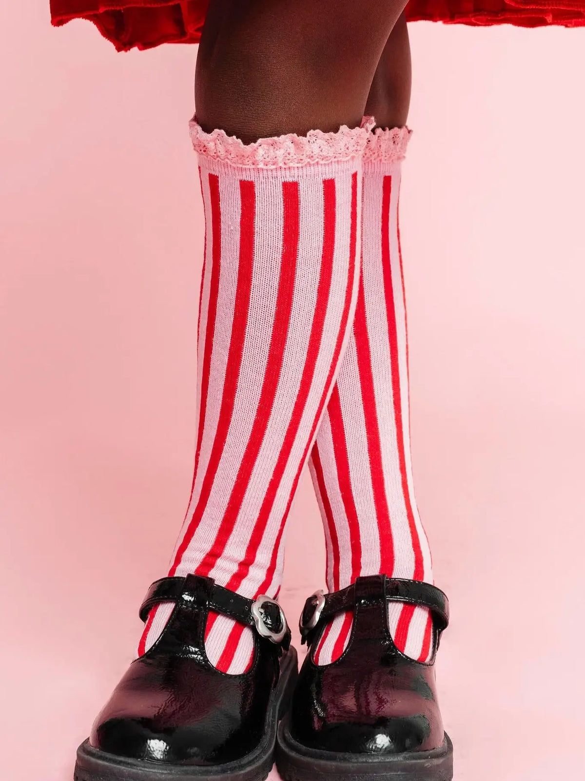 Model Wearing Little Stocking Co. Candy Stripe Lace Top Knee High Socks