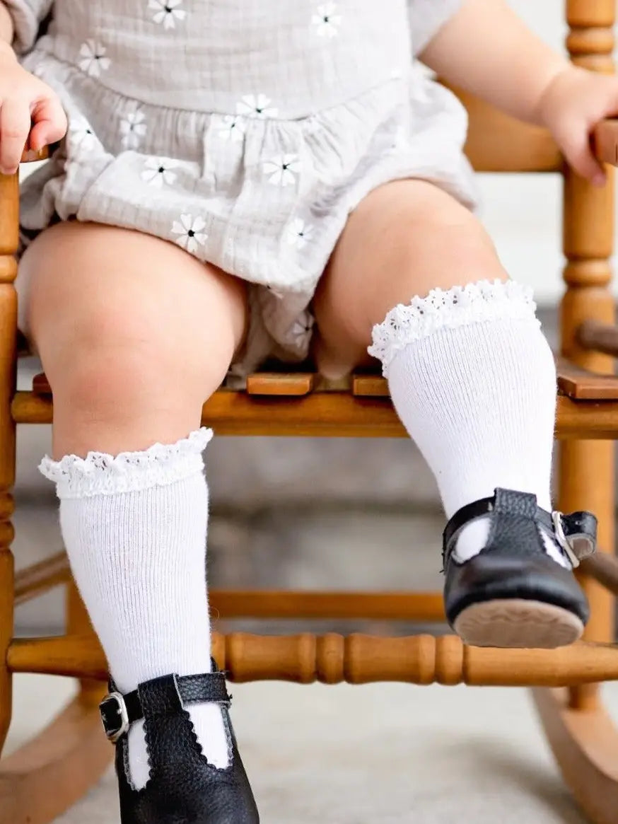 Model Wearing Little Stocking Co. White Lace Top Knee High Socks
