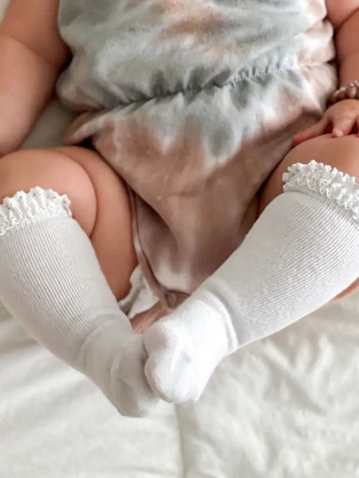 Model Wearing Little Stocking Co. White Lace Top Knee High Socks