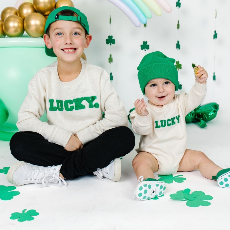 Models wearing Lucky Varsity Patch St. Patrick's Day Long Sleeve Romper - Natural