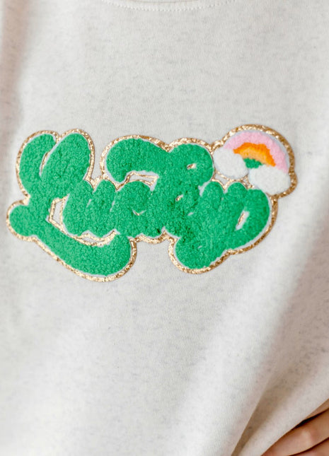Sweet Wink model wearing Lucky Rainbow Patch St. Patrick's Day Sweatshirt - Natural