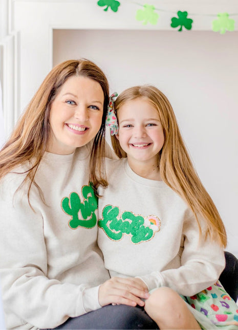 Models wearing Sweet Wink Lucky Rainbow Patch St. Patrick's Day Adult Sweatshirt - Natural