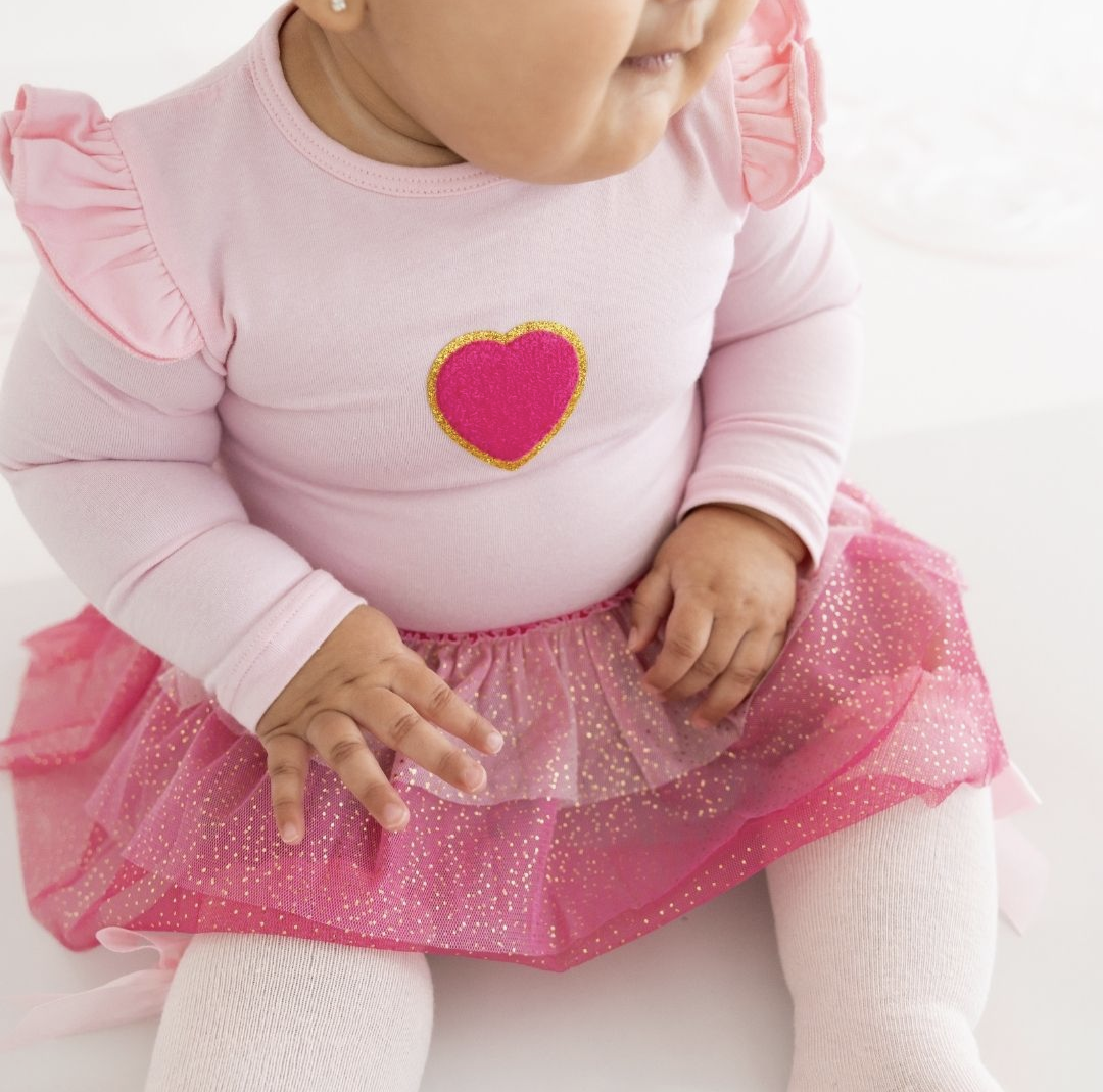 Model Wearing Sweet Wink Pink Petal Valentine's Day Long Sleeve Tutu Bodysuit