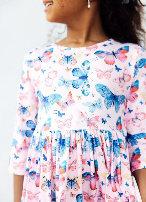 Model Wearing Mila & Rose Little Flutters 3/4 Sleeve Pocket Twirl Dress
