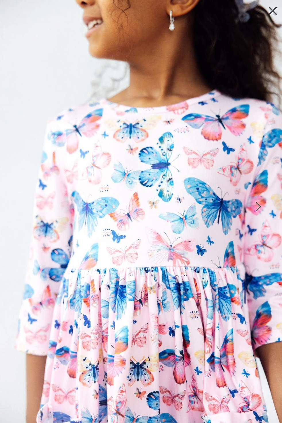 Model Wearing Mila & Rose Little Flutters 3/4 Sleeve Pocket Twirl Dress