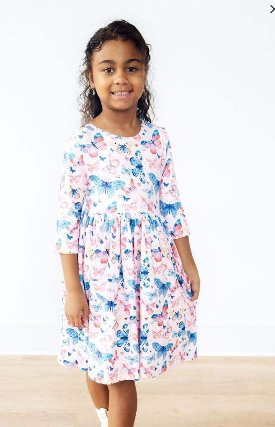 Model Wearing Mila & Rose Little Flutters 3/4 Sleeve Pocket Twirl Dress