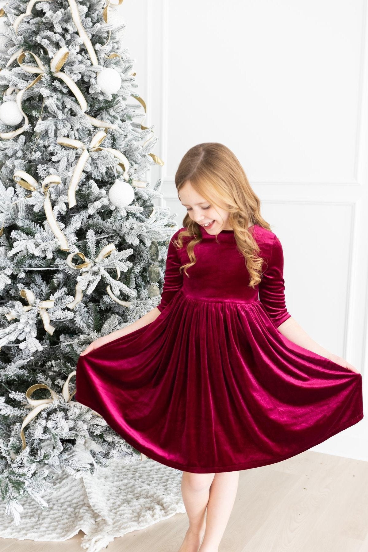 Model Wearing Mila & Rose Cranberry Velvet Twirl Dress
