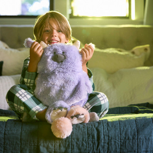 Model With Demdaco Calming Cuddlers Purple Monster Stuffed Animal 10"