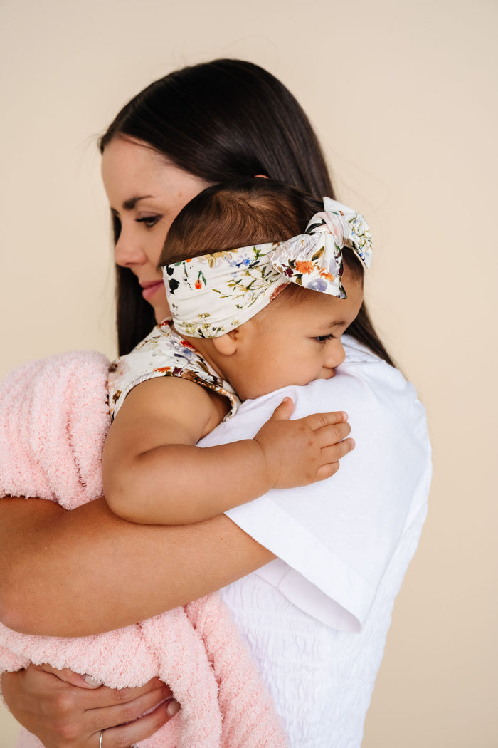 Model Wearing Lou Lou & Company Chenille Blanket - Blush Pink - Small & Large
