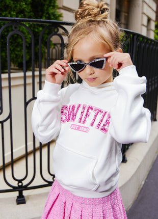 Model Wearing Lola And The Boys Pink Denim Sparkle Pleated Skirt & Swiftie Sweatshirt